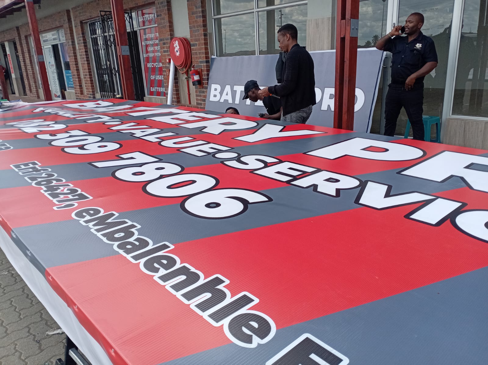 Large format sign production and installation for Battery Pro