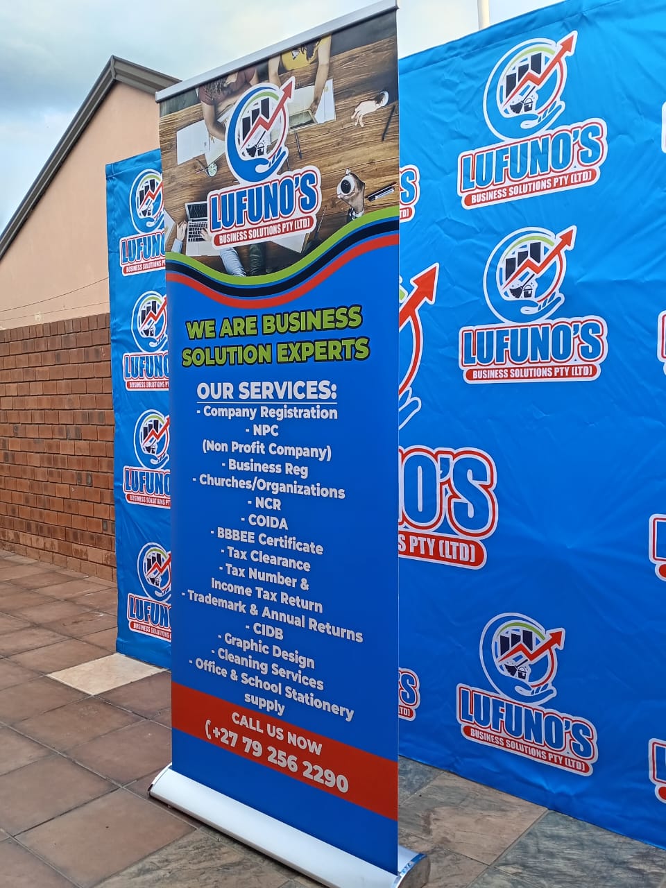 Branded roll-up banner and backdrop display
